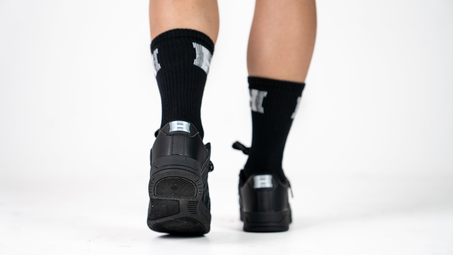 Images of black HOODS Statement Sneaker on feet size 5
