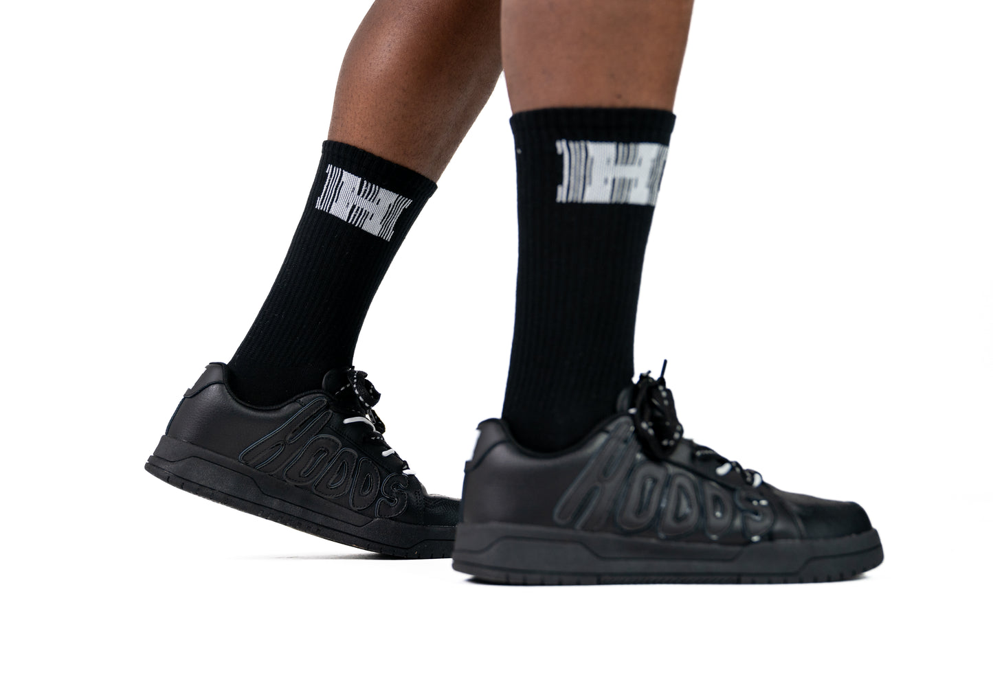 Images of black HOODS Statement Sneaker on feet size 11