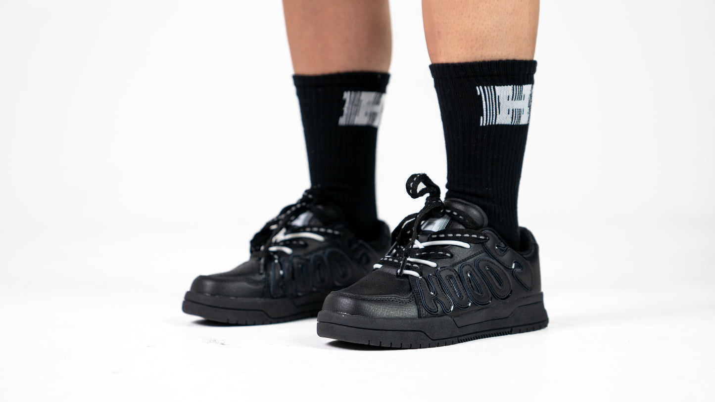 Images of black HOODS Statement Sneaker on feet size 5