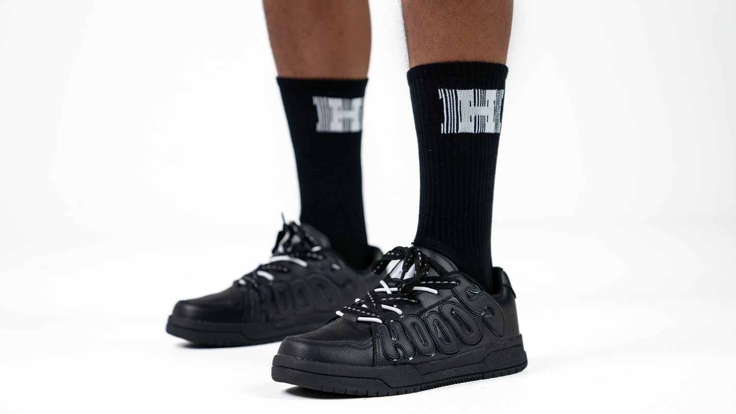 Images of black HOODS Statement Sneaker on feet size 11