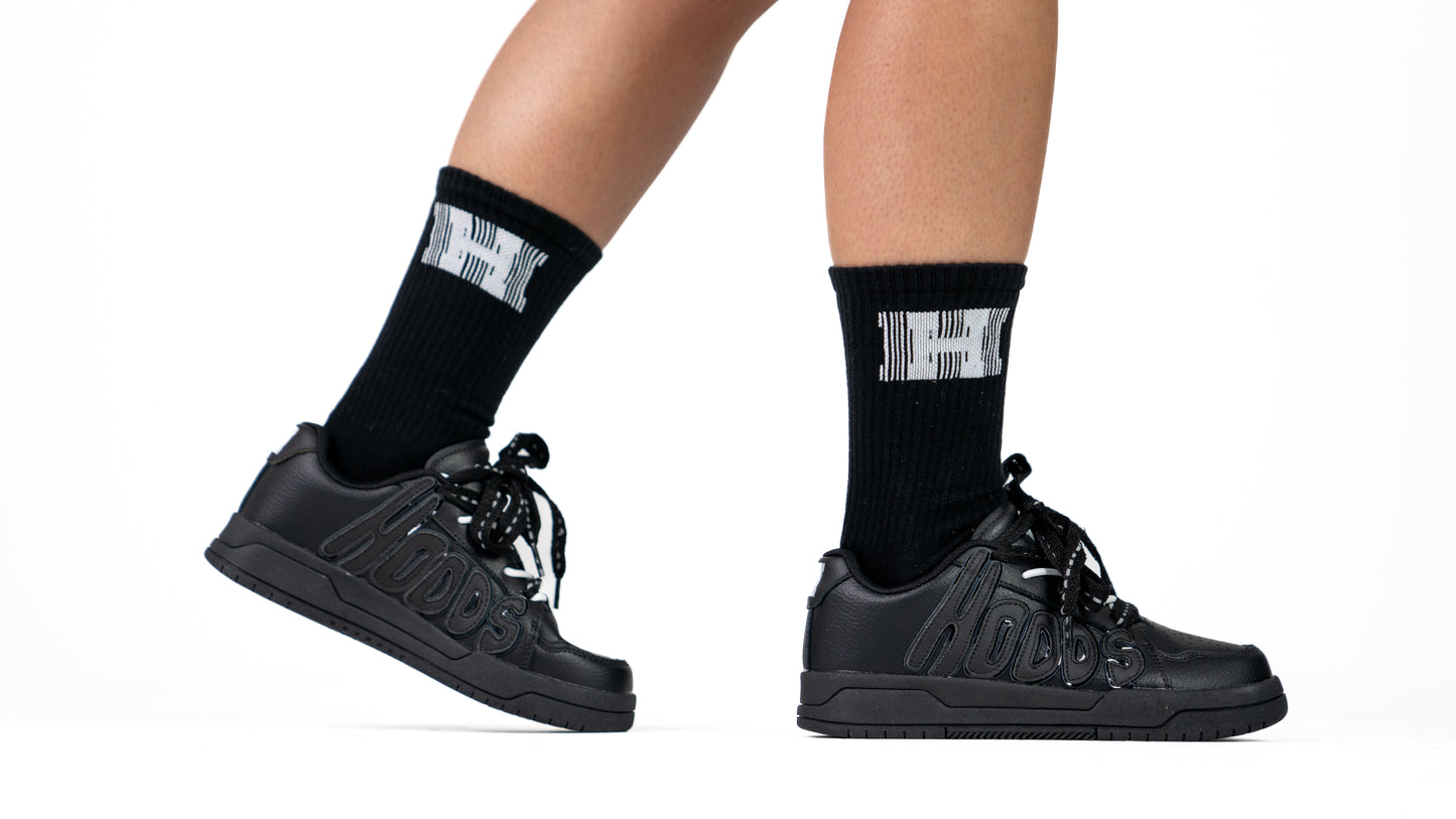 Images of black HOODS Statement Sneaker on feet size 5